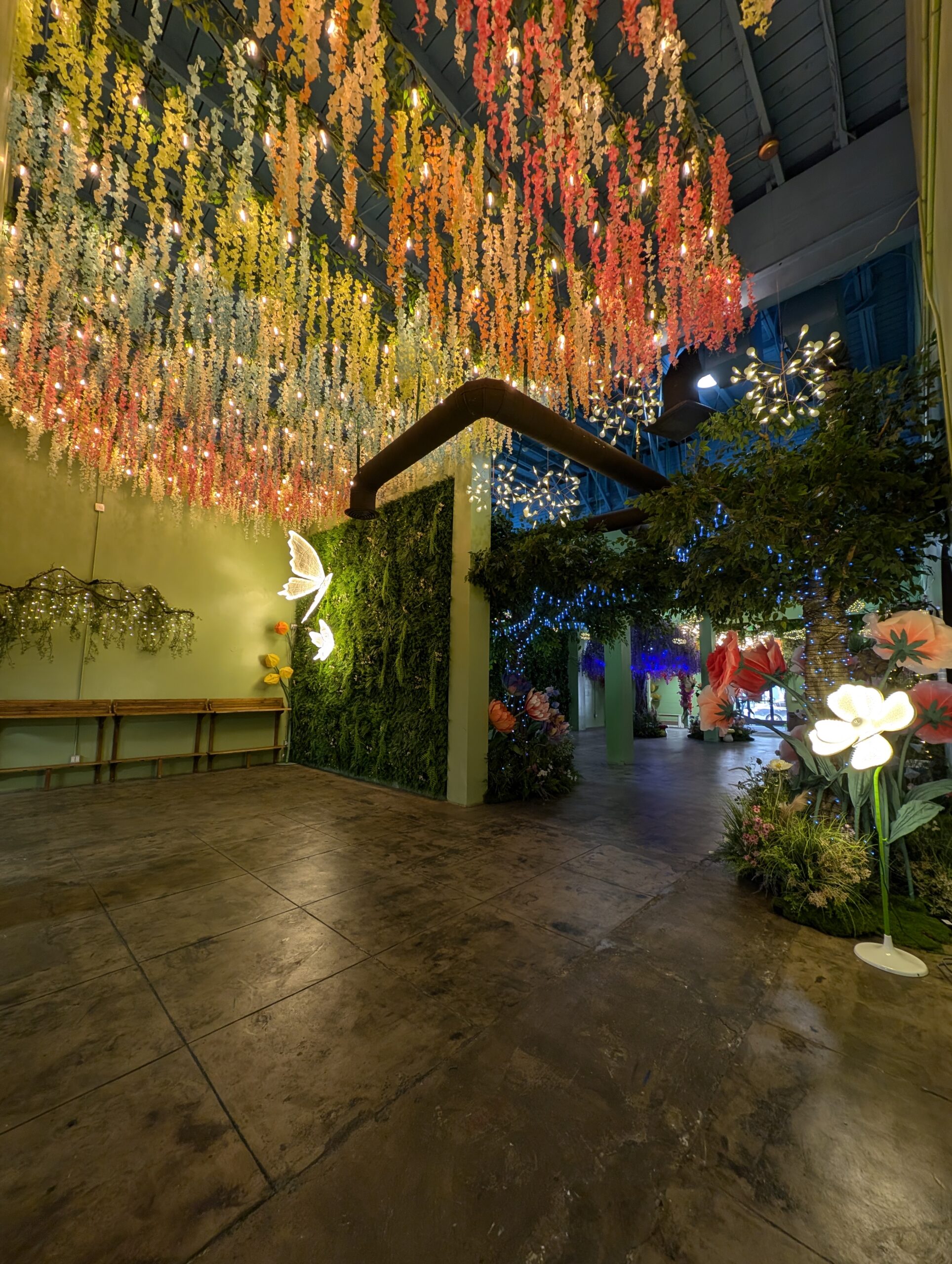 Hanging floral lights inside Happy Humble Hub