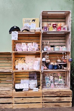 Wooden Village Shelf crates displaying local products