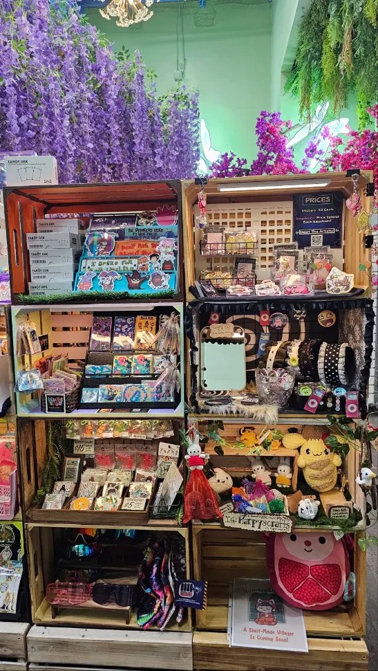 Art prints, accessories and crochet toys on Villager shelves at Happy Humble Hub