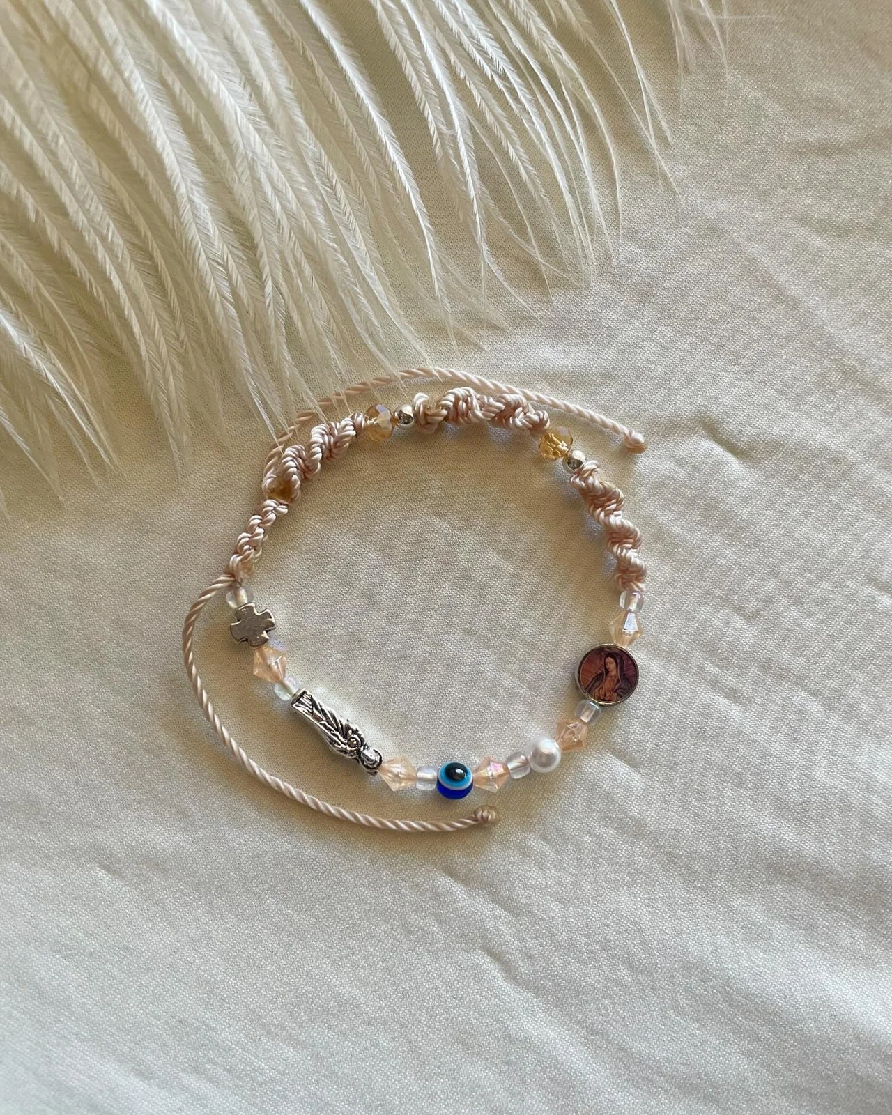 Beaded bracelet with an evil-eye accent by Jaysoulessences