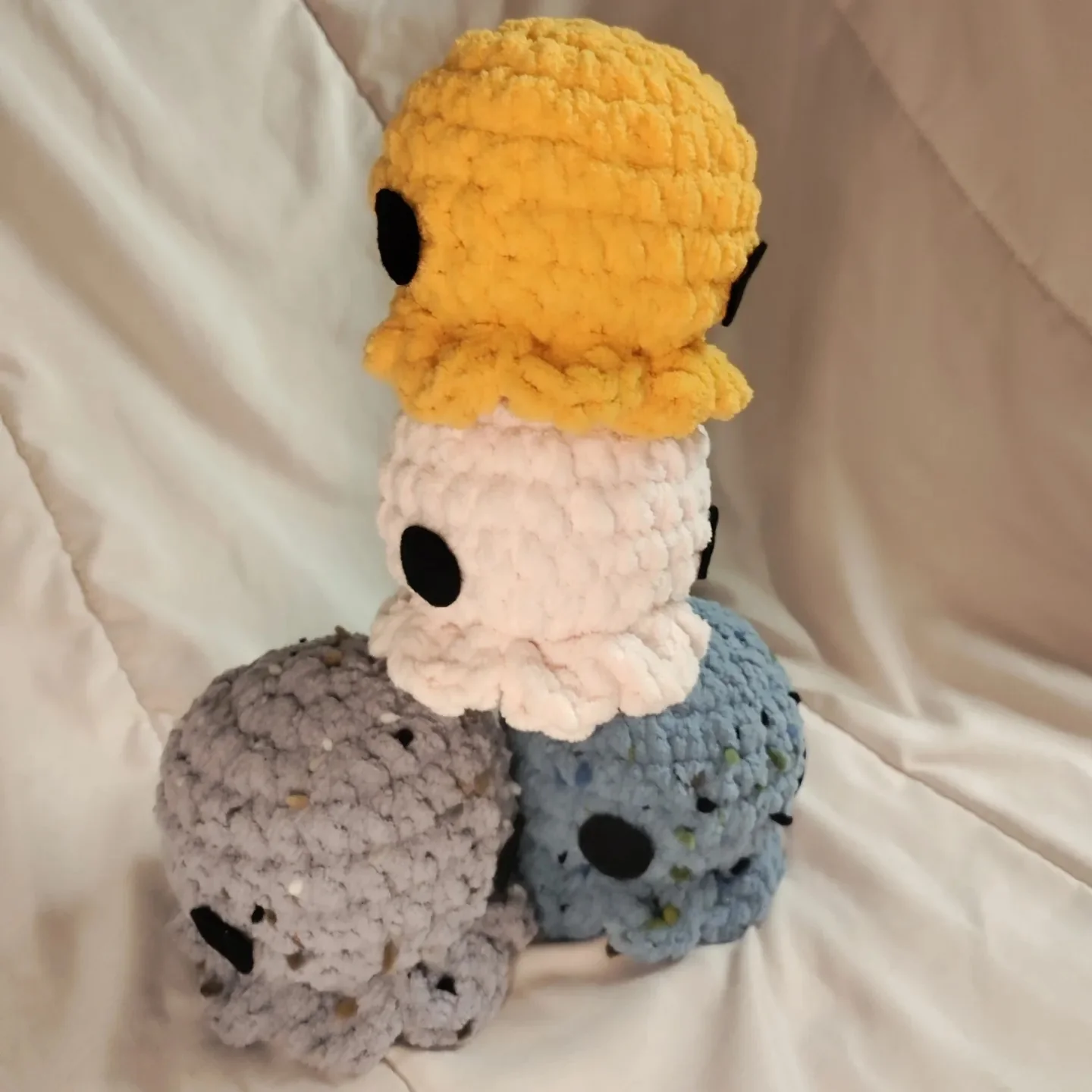 Stack of crocheted octopus plush toys by MyMochiMaiden